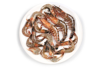 Raw shrimp on a white table.