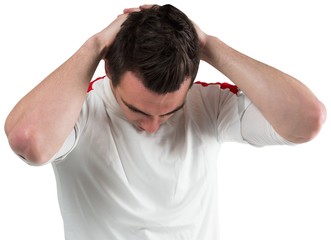 Fototapeta premium Disappointed football fan looking down