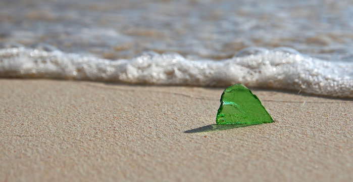 Single Green Sea Glass On The Shore