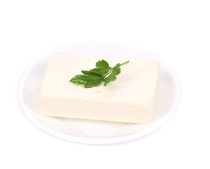 Tofu cheese on white plate.