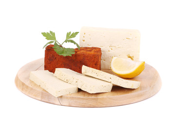 Tofu cube in paprika and slices with lemon.