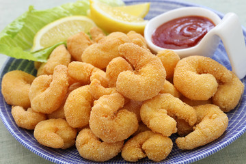 popcorn shrimp with ketchup sauce isolated on white background