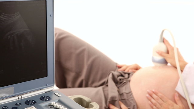 Pregnant woman having a sonagram scan