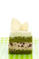 Obraz na płótnie Canvas Matcha green tea cake isolated on white background