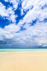 Fototapeta na wymiar Dark storm clouds above a deserted beach