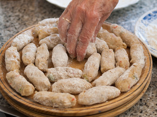 Preparing a homemade croquettes.