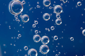 Air bubbles . Background blue. Macro