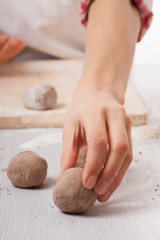 cook hands preparing dough