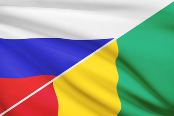 Series of ruffled flags. Russia and Republic of Guinea.