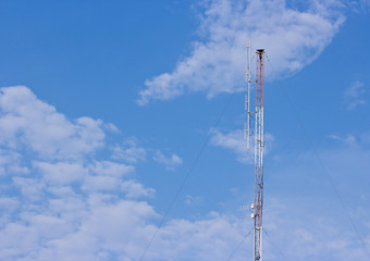 Telecommunication signal tower on blue sky