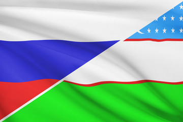 Series of ruffled flags. Russia and Republic of Uzbekistan.