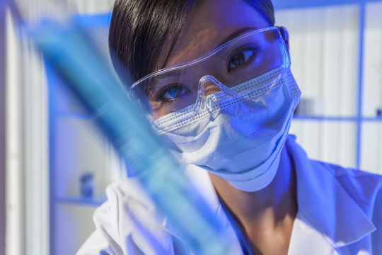 Chinese Woman Scientist With Test Tube in Laboratory