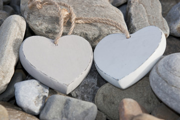 two love hearts on a rocky beach