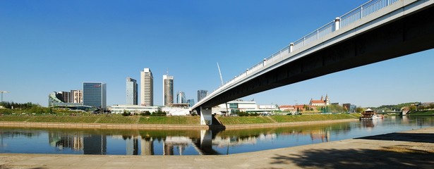 The Vilnius city walking bridge with skyscrapers