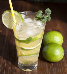 Mojito with fruit lime, mint leaves and ice.