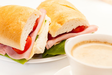 Panini sandwich with ham, cheese and tomato