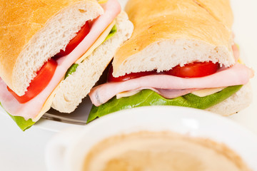 Panini sandwich with ham, cheese and tomato
