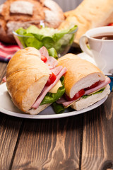 Panini sandwich with ham, cheese and tomato