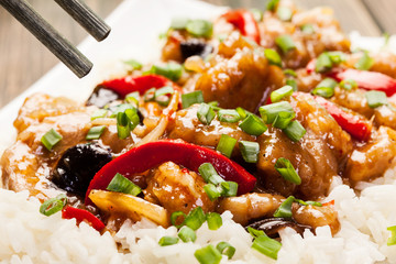 Sirloins on sweet and sour sauce served with rice