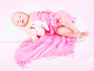 Fototapeta na wymiar Sweet newborn baby with soft toy