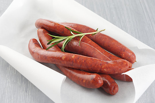 Lamb sausage with rosemary_string in baking paper