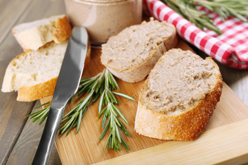 Fresh pate with bread on wooden table