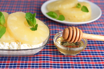Naklejka na ściany i meble Bowl of tasty cottage cheese with pineapple, close up