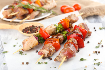 Pork kebab on wooden table close up