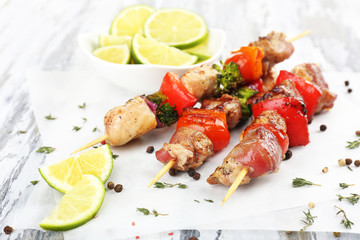 Pork kebab on wooden table close up