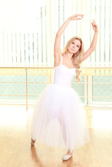 Beautiful balerina dancing in ballet class © Africa Studio