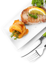 Grilled steak and fried potato pieces isolated on white