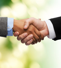 businessman and businesswoman shaking hands