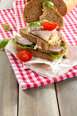 Delicious sandwiches with meet on table close-up