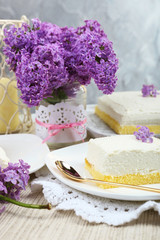 Delicious dessert with lilac flowers
