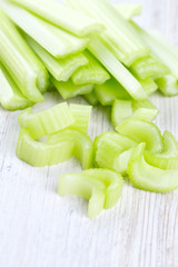 cut celery on wooden table