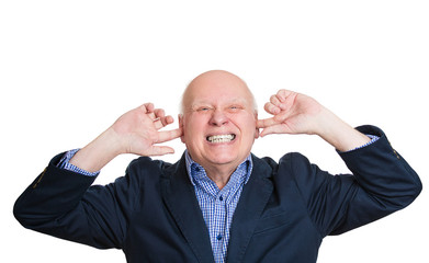 That is too loud. Man covers his ears, annoyed by noise upstairs