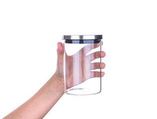 Hand hold Empty glass jar with aluminum lid isolated on white ba