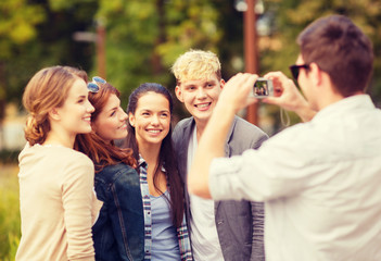 teenagers taking photo outside