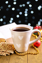 Composition of book with cup of coffee and Christmas