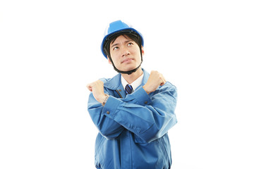 疲れた表情の作業員