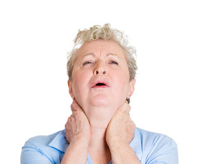 Headshot senior elderly woman with neck pain on white background