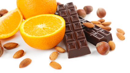 Chocolate, orange and nuts isolated on white