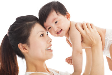 Obraz na płótnie Canvas Happy mother holding adorable child baby boy