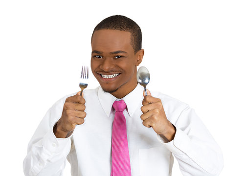 Hungry man holding fork and spoon isolated on white background 