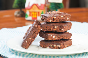 a pile of nutty milk chocolate coated brownies