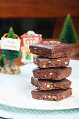 a pile of nutty milk chocolate coated brownies