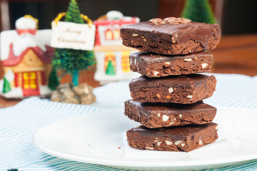 a pile of nutty milk chocolate coated brownies