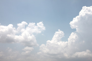Naklejka na ściany i meble White clouds on a blue sky.