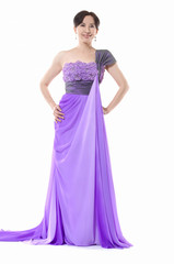 female fashion model posing in purple dress