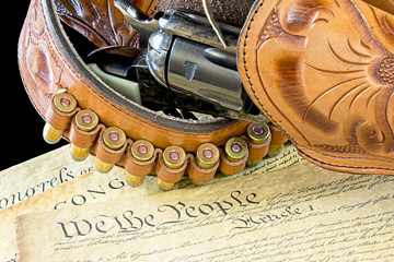 Old western pistol and gun belt with bullets